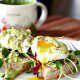 Poached eggs on Sourdough toast with avocado sauce and and microgeens