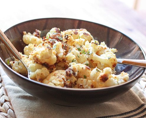 crispy cauliflower topped with tahini sauce and chopped fresh mintA side dish everyone will be fighting over! Oven roasted, crispy cauliflower with tahini lemon sauce. @danielleomar