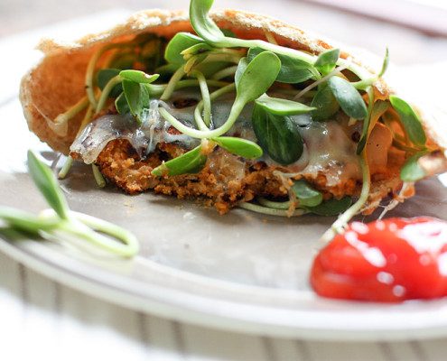 Freezer Friendly bean burgers on whole wheat pita! Perfect for a quick, healthy vegetarian dinner!