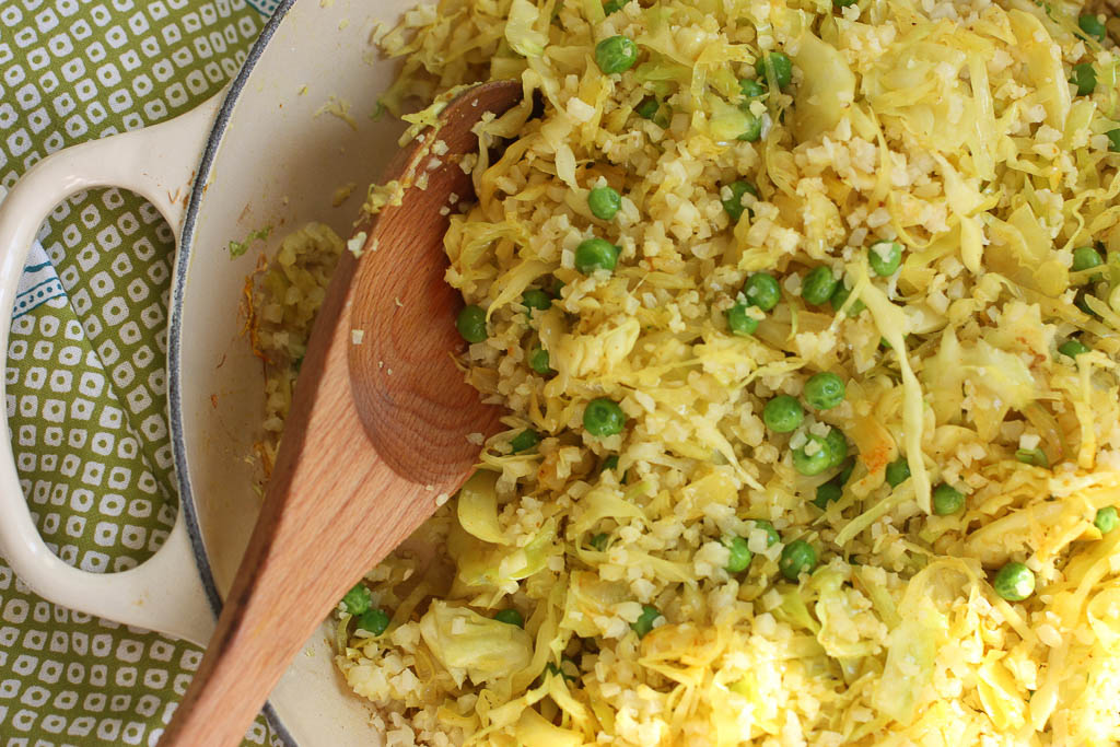 Super simple Indian inspired cabbage stir fry recipe with cauliflower rice and peas. Gluten free, low carb and delicious! 